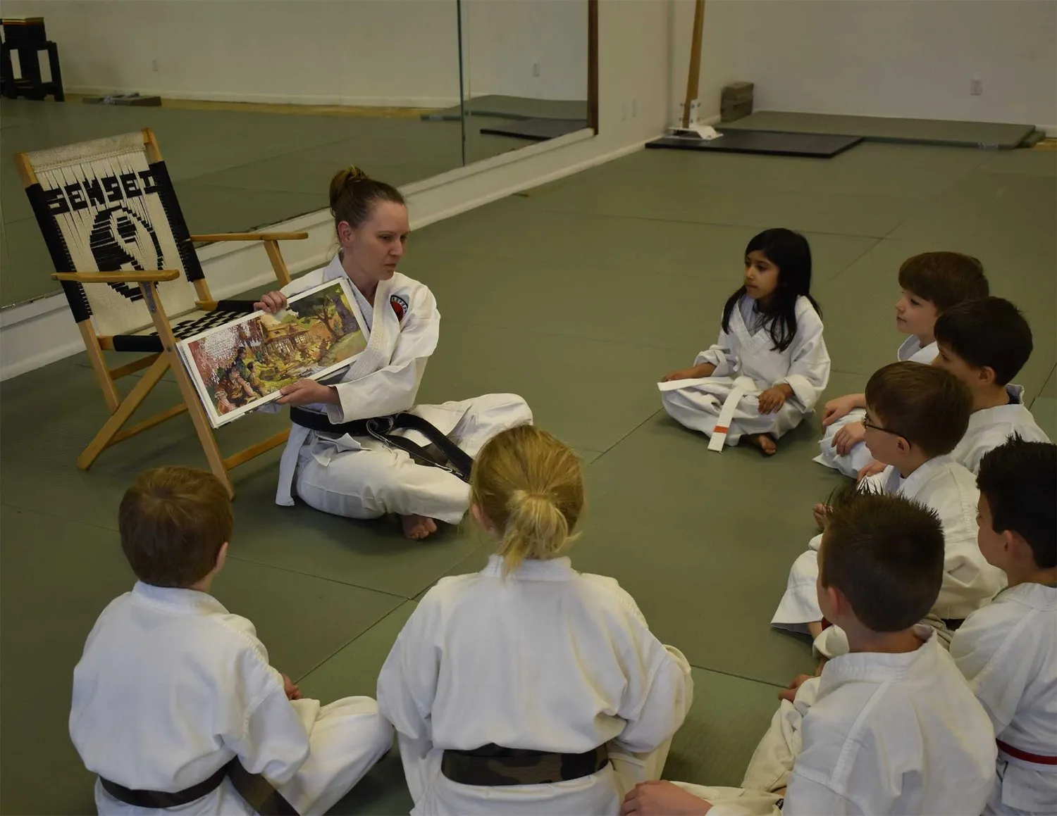 kids listening to sensei in martial arts lessons