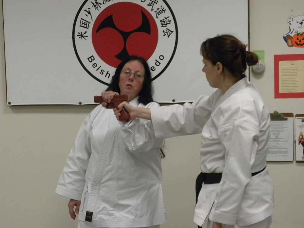 adult student and sensei in kara