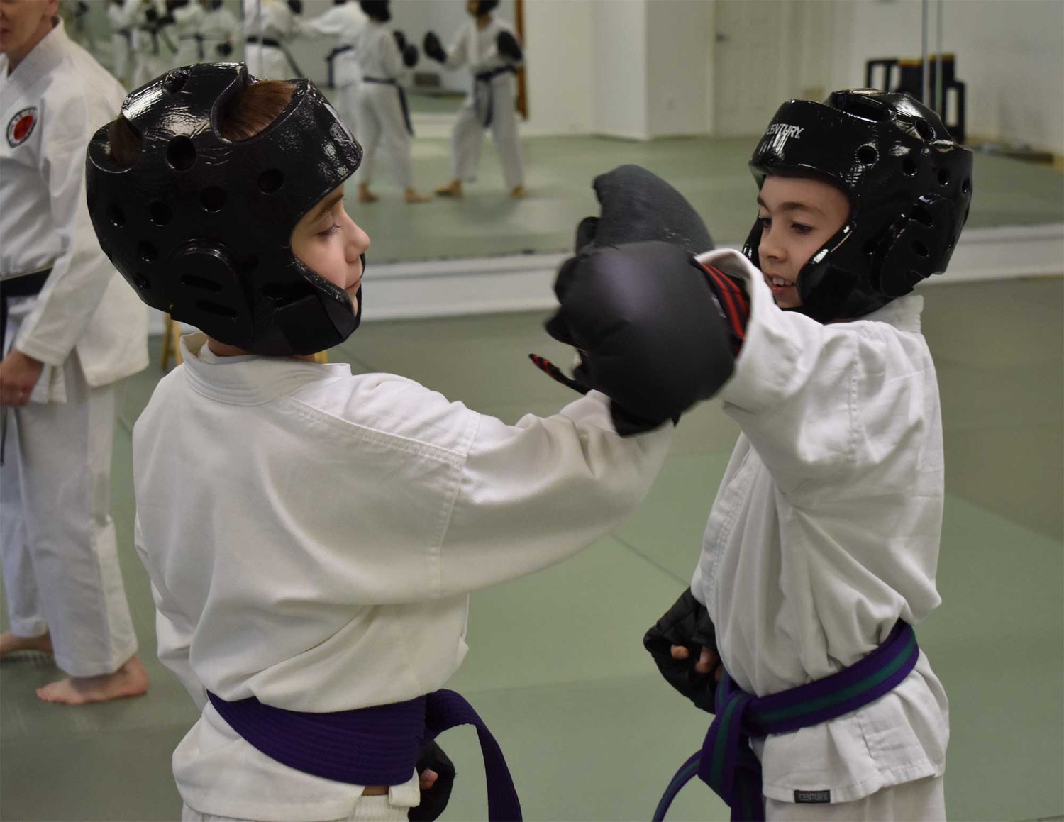two kids taking a karate class in Chesterland
