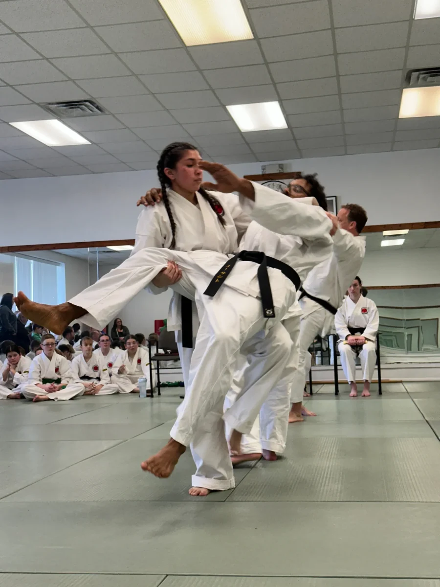 two people participating in a martial arts class for adults