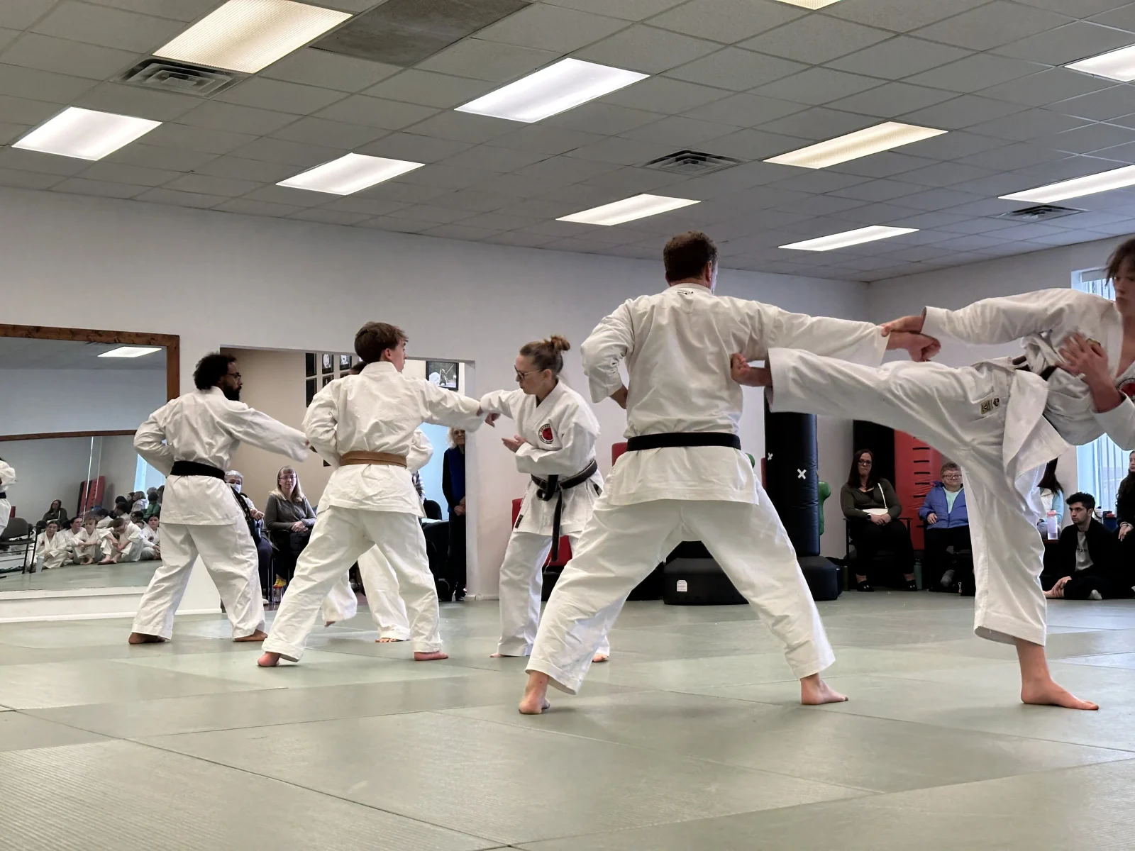 people participating in a martial arts class for adults